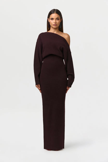Model facing forward in the deep burgundy-brown off-the-shoulder knit maxi dress with long sleeves. 18