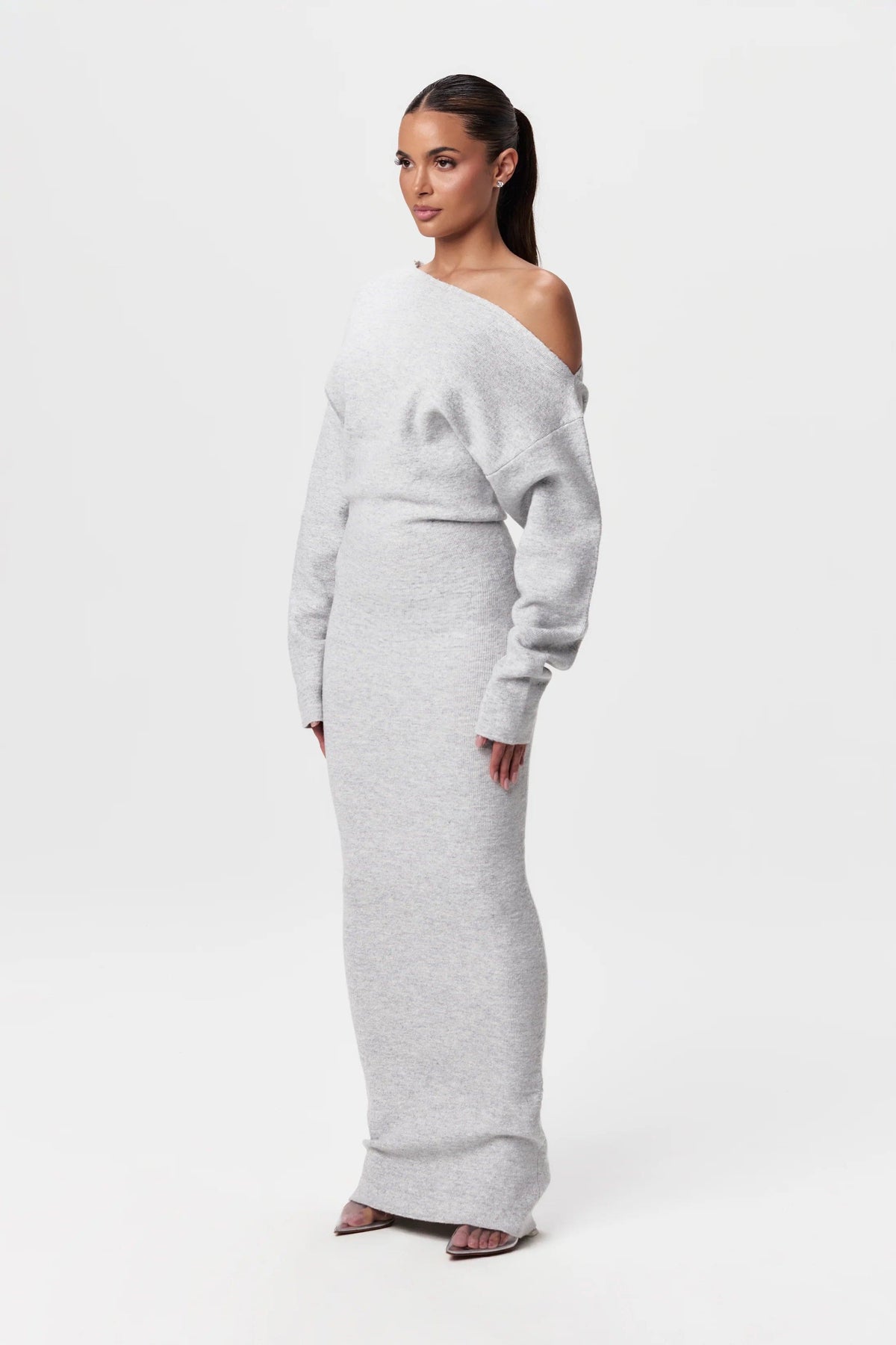 Three-quarter view of the light grey knit maxi dress, showing the soft texture and sleeve shape. 10
