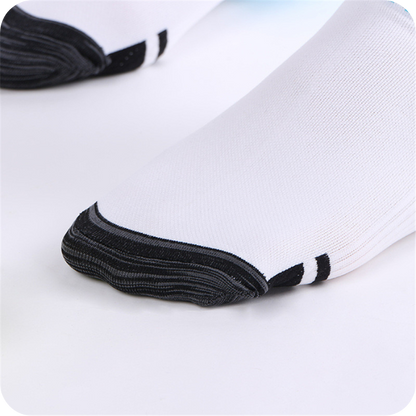 Close-up of the dark reinforced toe of a white sock, with two black stripes beside the toe cap. 4
