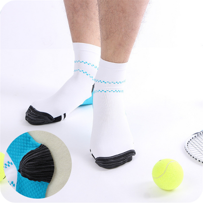 Man standing in white ankle socks with blue dotted stripes beside tennis balls, with an inset close-up of the blue heel. 2