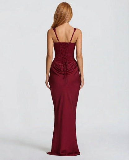 Back view of the deep red dress showing adjustable straps, criss-cross lacing with dangling ties and the gathered drape below. 10