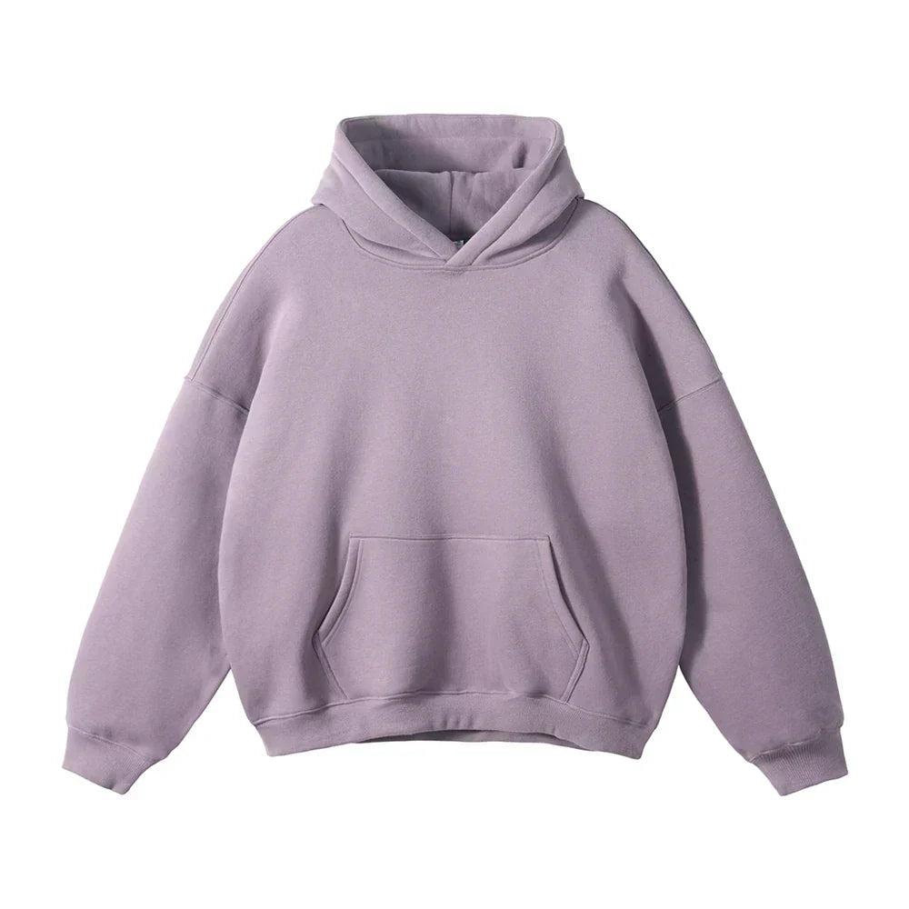 Front view of a dusty lilac hoodie laid flat, showing the drop shoulders, ribbed cuffs and hem, and large front pouch pocket. 11