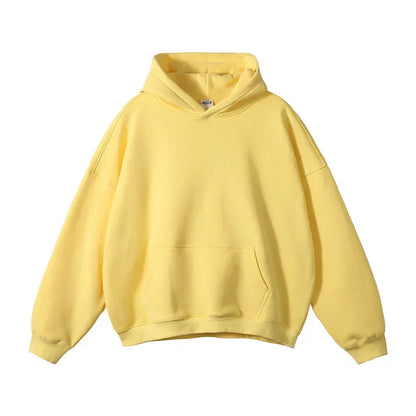 Front flat view of a pale yellow pullover hoodie with drop shoulders, ribbed cuffs and hem, hood and front kangaroo pocket. 19