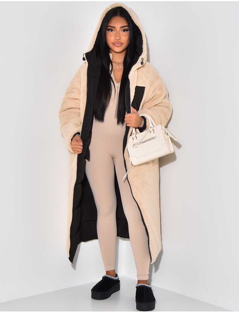 Model wears the beige teddy-fleece side open, revealing the black quilted lining, with the hood up and a white handbag. 8