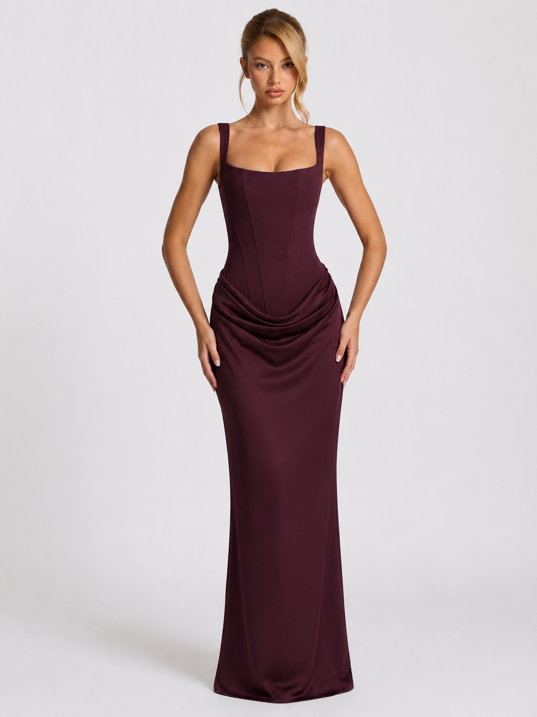 Straight-on front view of the plum dress, showing the square-neck corset bodice, wide straps and draped hip over the long skirt. 16