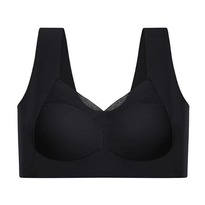 Black seamless bra laid flat against a white background, showing the mesh neckline panel, wide straps and smooth cups. 11