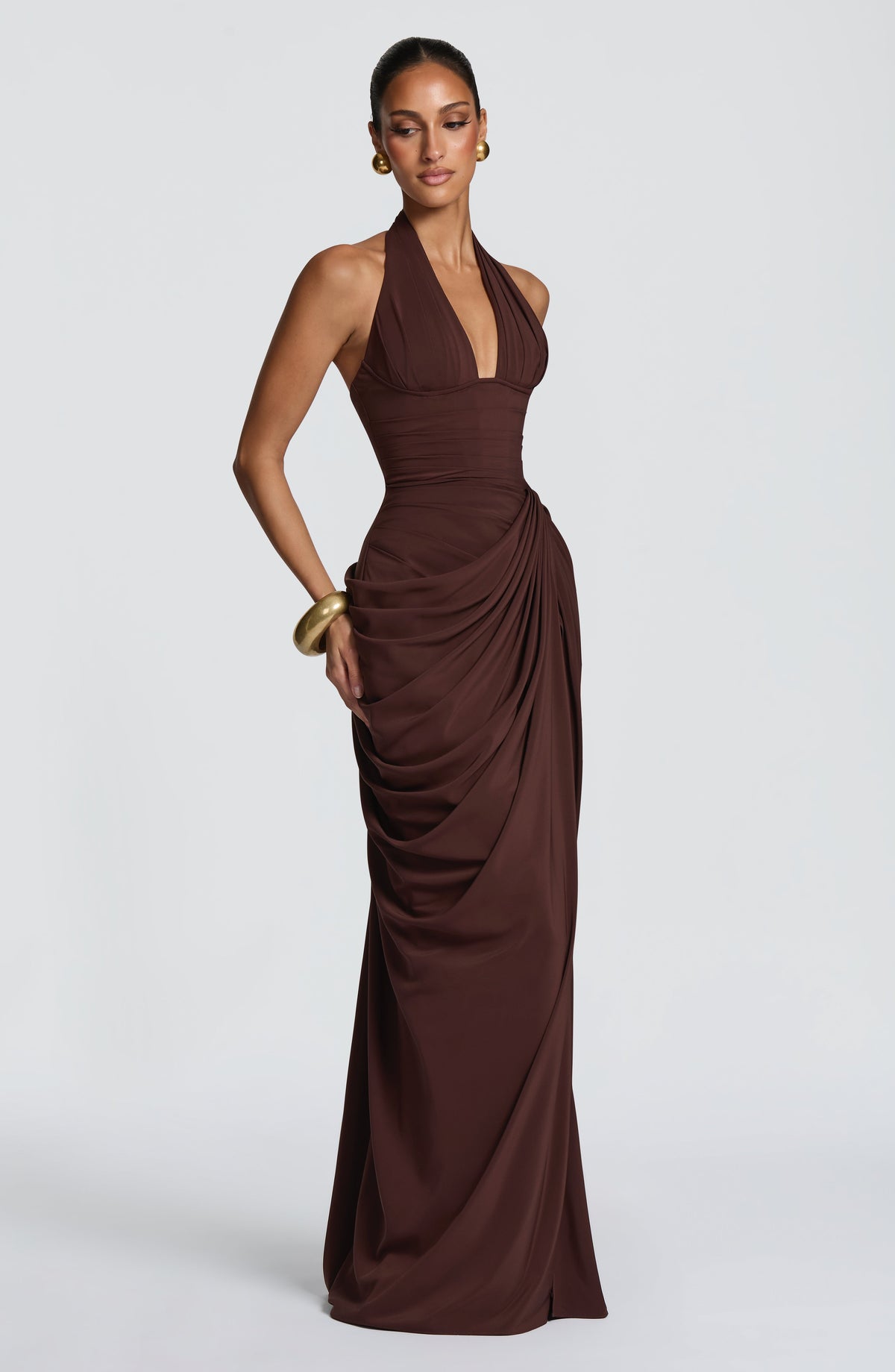 Angled side view of the brown dress, showing the draped chiffon gathered at the hip over a fitted corset waist. 28