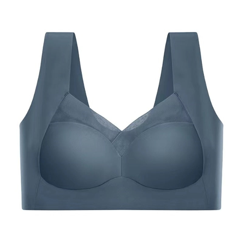 Slate blue seamless bra laid flat against a white background, showing the mesh neckline panel, wide straps and smooth cups. 9
