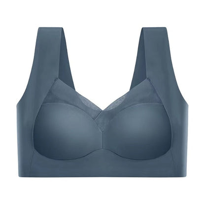 Slate blue seamless bra laid flat against a white background, showing the mesh neckline panel, wide straps and smooth cups. 9
