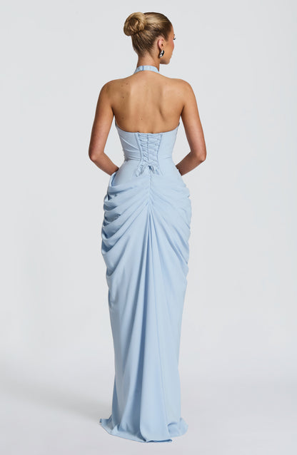 Back view of the pale blue dress showing the lace-up corset back, halter clasp and gathered, ruched skirt. 10