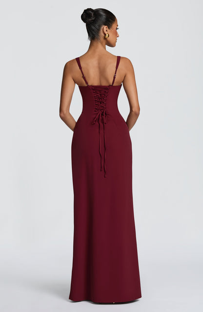 Back view of the burgundy maxi dress showing lace-up corset back and adjustable thin straps. 18