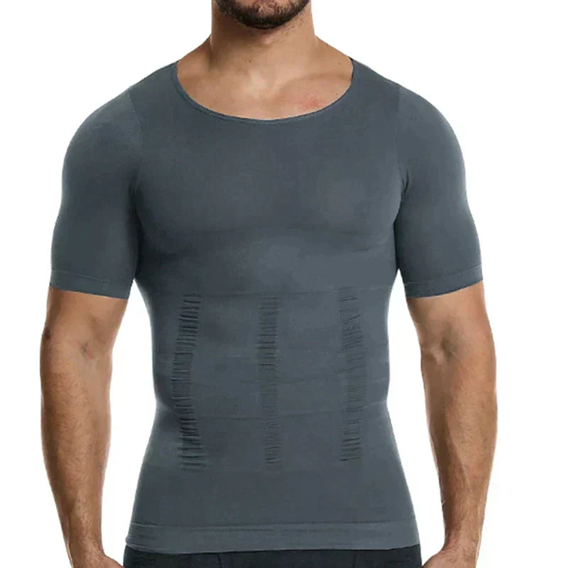 Man wearing the grey compression top from the front, showing its close fit and ruched shaping lines across the stomach. 6