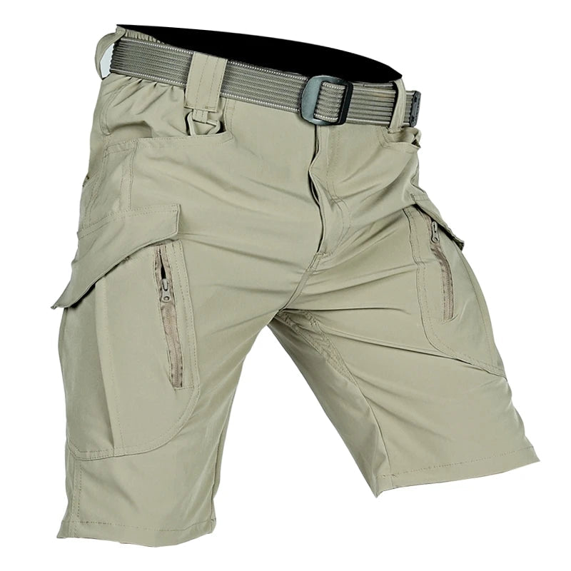 Light khaki cargo shorts shown at an angle with a matching webbing belt and a plastic buckle, with zipped thigh pockets visible. 3