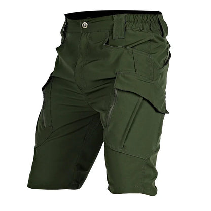 Dark olive green cargo shorts shown at an angle, with a large flapped thigh pocket, side zip and elasticated back waistband. 4