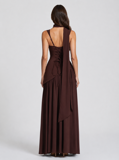 Back view in chocolate brown showing the lace-up corset back, adjustable straps and a long scarf panel draped down the back. 2