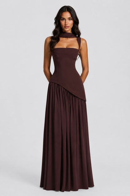 Front view in deep brown with the slit hidden, hands clasped behind the back, showing the sculpted bodice and full gathered skirt. 4
