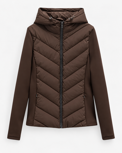 Front view of the jacket in dark brown, with chevron quilting, stretch sleeves, contrasting black front zip and drawcord hood. 8