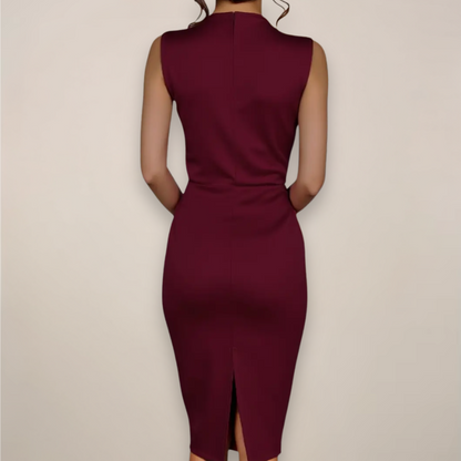 Back view of the burgundy dress on a model, showing the plain fitted back and centre vent at the hem. 2