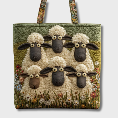 Same quilted tote shown against a plain light background, six textured sheep and a wildflower border above floral handles. 2