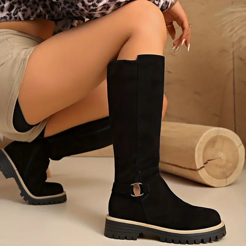 Model crouching in black tall boots with shorts, showing the straight shaft, buckle strap and thick non-slip sole. 4
