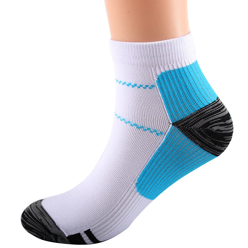Single white ankle sock on a foot form, showing blue zigzag stripes, a ribbed blue heel panel and dark heel and toe. 5