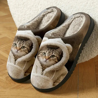 Pair of slippers resting on a parquet floor beside a fluffy rug, showing the plush lining and thick black sole. 4