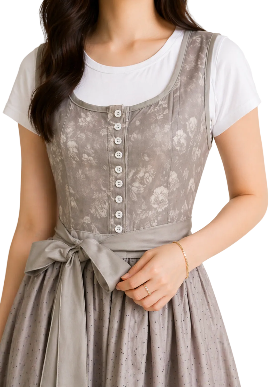 Close-up of the grey floral bodice with white buttons, scooped neckline and waist sash tied in a bow, worn over a white t-shirt. 1