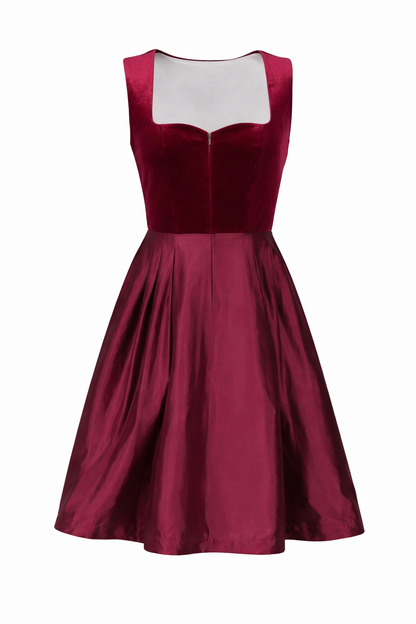 Front view of the dress without the apron, showing the sweetheart neckline, front zip and full pleated skirt. 4