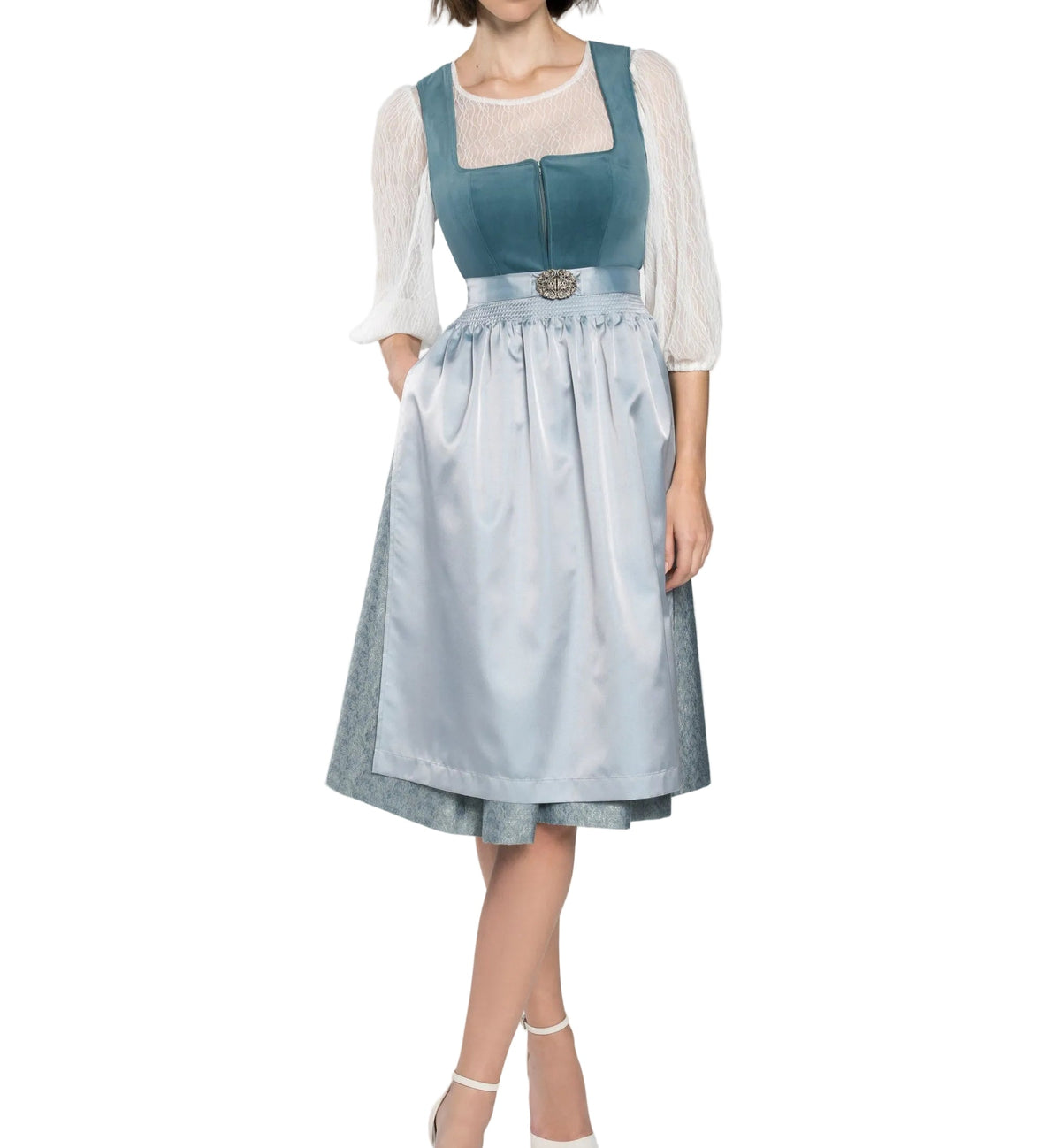 Full-length view of a model wearing a teal velvet dirndl bodice, pale blue satin apron with ornate clasp and white lace blouse. 1