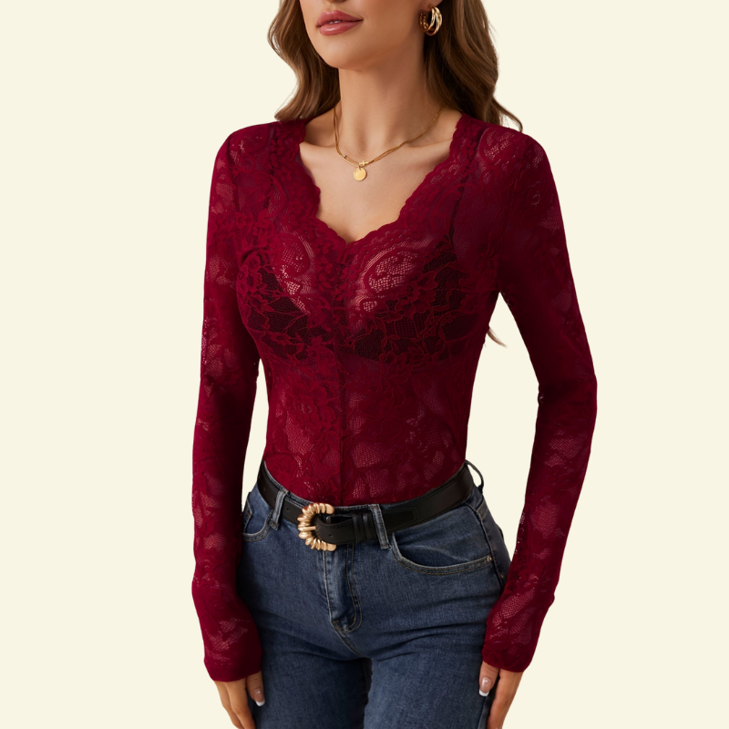 Burgundy red sheer lace top with scalloped V-neck on a model, worn with dark blue jeans and a black belt. 4