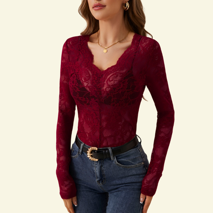 Burgundy red sheer lace top with scalloped V-neck on a model, worn with dark blue jeans and a black belt. 4