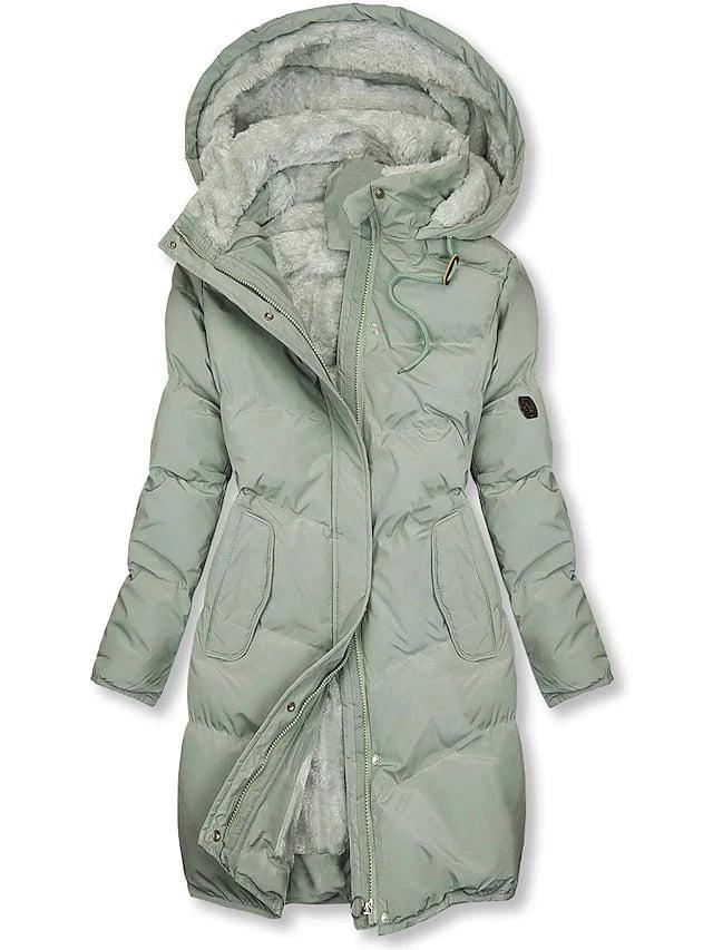 Front view of the same padded coat in pale sage green, with a light grey fleece lining visible at the open zip. 2