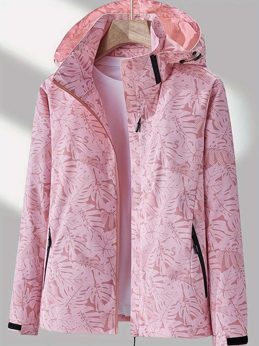 Pink leaf-print version of the hooded jacket on a hanger, unzipped over a light top, with black-trimmed pockets and cuffs. 4