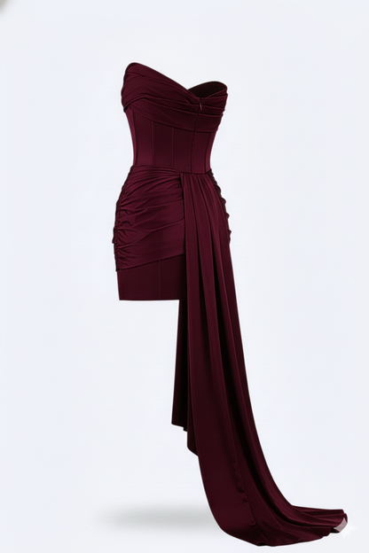Back three-quarter view of the dress showing the gathered sweetheart neckline, ruched skirt and the flowing cascade of fabric ending in a long train. 3