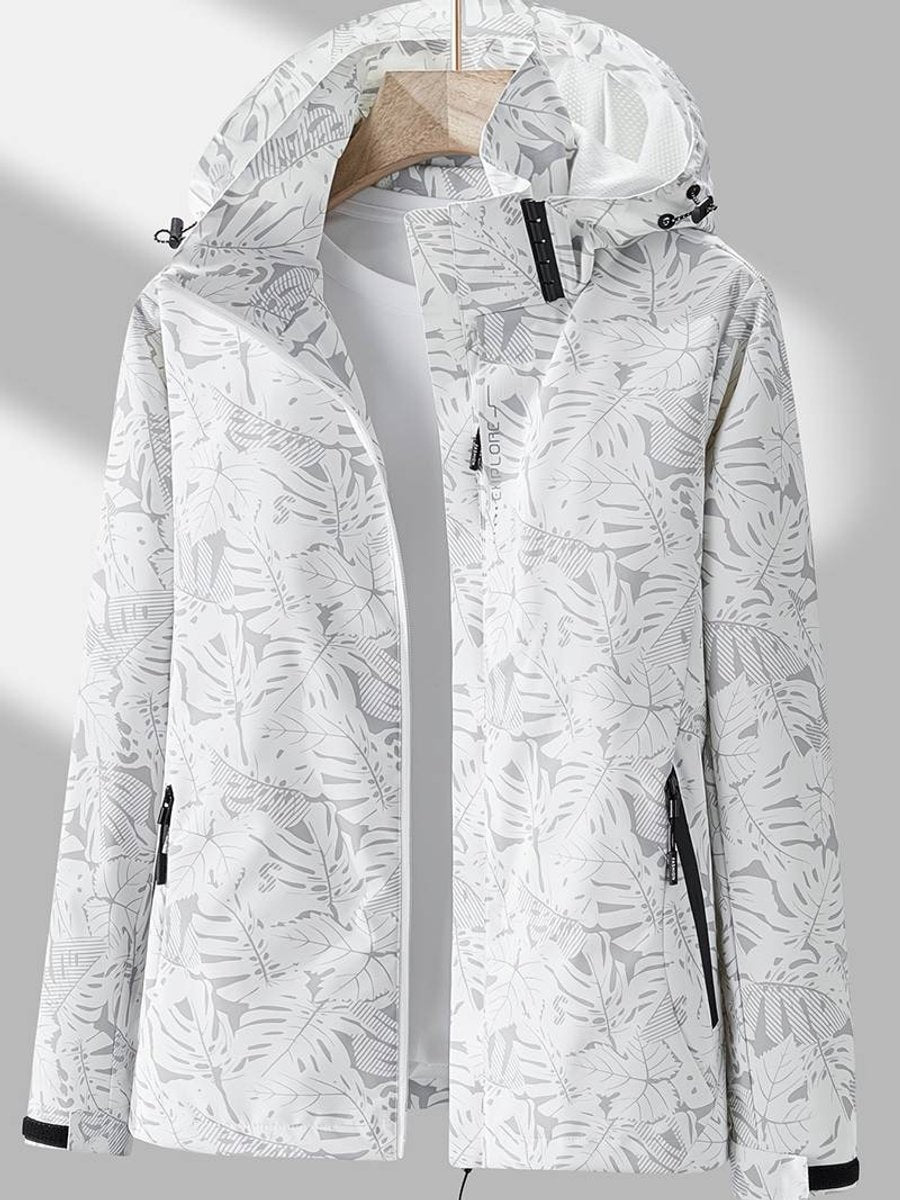 White and pale grey leaf-print version of the hooded jacket on a hanger, open to show black pocket zips and cuff tabs. 3