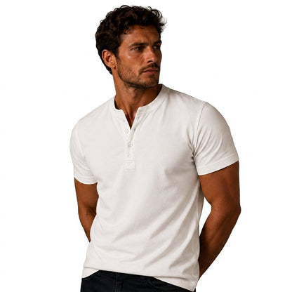 Close-up of a man wearing the white top, showing the buttoned placket and fitted short sleeves, hands behind his back 3