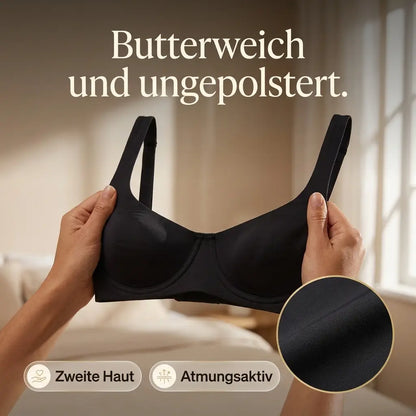 Hands holding up a black balconette bra in a bright bedroom, with a circular close-up of the smooth fabric and feature badges. 9