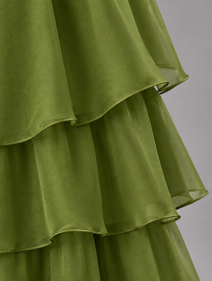 Close-up of the olive green chiffon skirt tiers, showing the sheer layers and fine rolled edges. 14