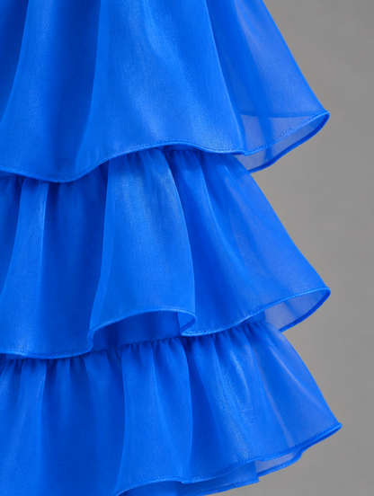 Close-up of the layered royal blue organza ruffles with neatly finished edges. 26