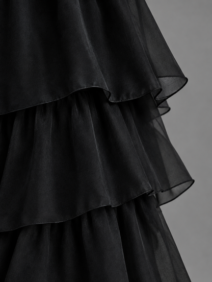 Close-up of the black chiffon skirt tiers, showing the layered ruffles and fine finished edges. 17