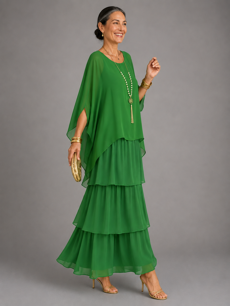 Side view of the tiered maxi dress in vivid green chiffon, worn by a smiling model with a gold clutch. 31