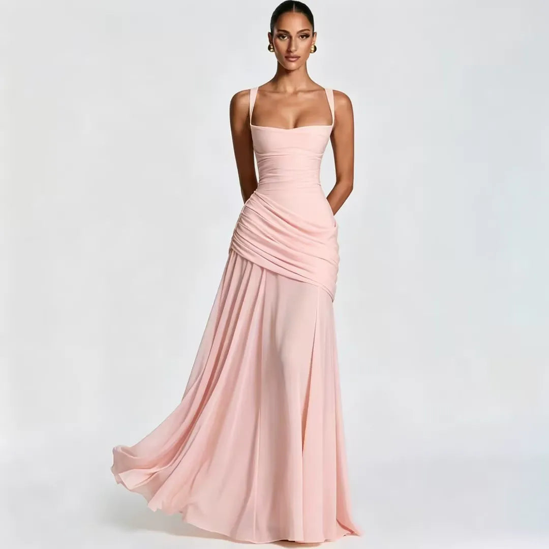 Blush pink maxi dress on a model, front view with square neckline, gathered waist drape and softly flowing skirt. 19