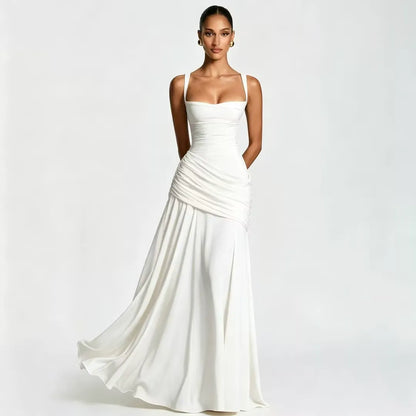 Ivory white maxi dress on a model, front view with square neckline, wide straps and draped waist, skirt swirling. 18