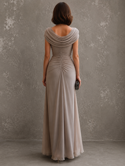 Back view of the taupe maxi dress, showing the draped back neckline and the centre ruching that runs down the back. 9