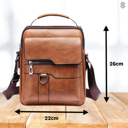Front of the tan shoulder bag with arrows marking its dimensions, 26cm in height and 22cm in width. 12