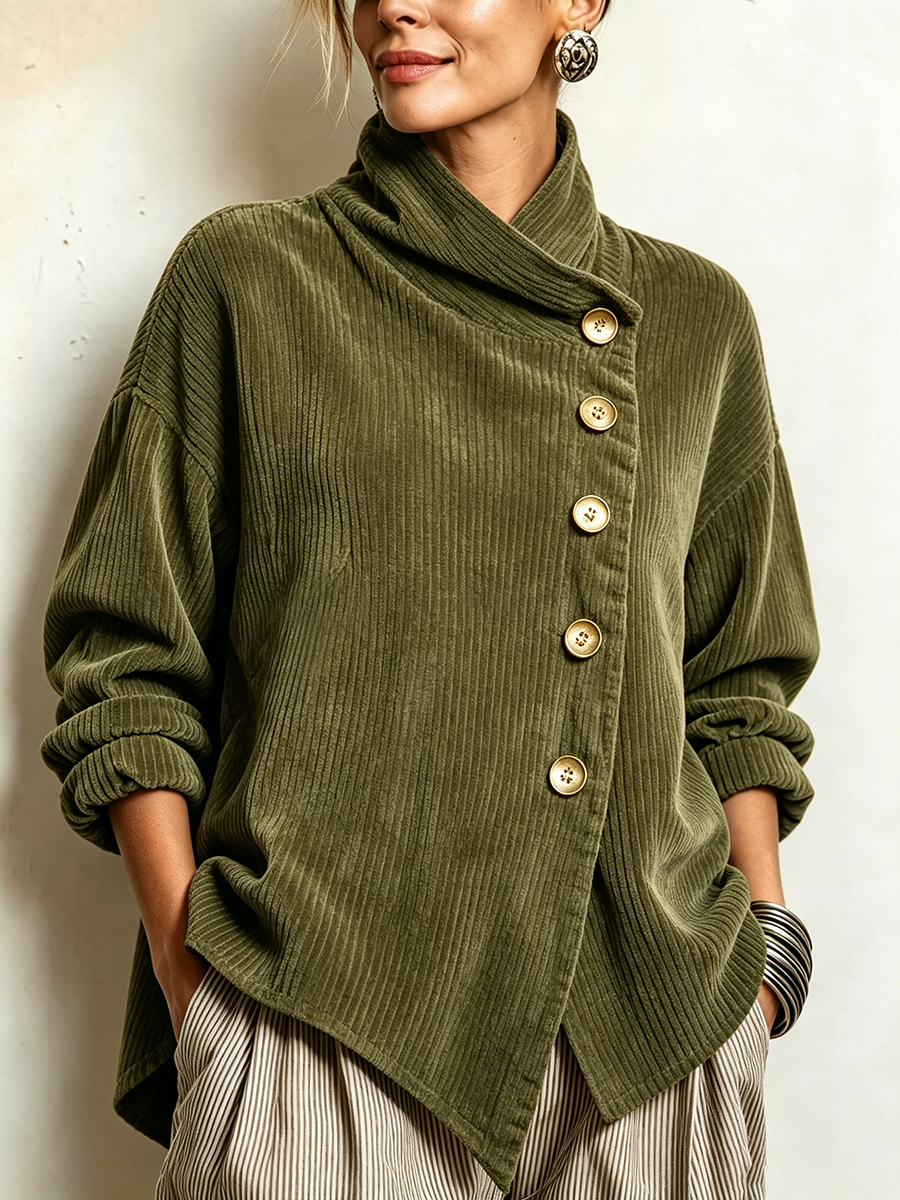 Close-up of the olive green ribbed corduroy top on a model, showing the slanted row of gold buttons and folded collar. 1