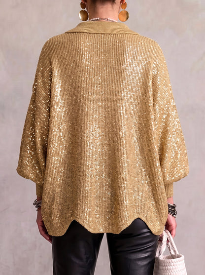Back view of the gold sequinned cardigan on a model, with shimmering sequins across the knit and a scalloped hem. 6