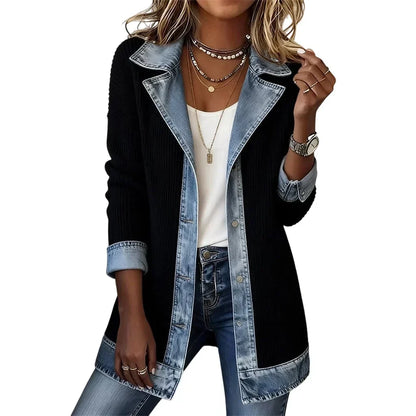 Black ribbed coat with light denim lapels, cuffs, button placket and hem, worn open over a white top and jeans. 13