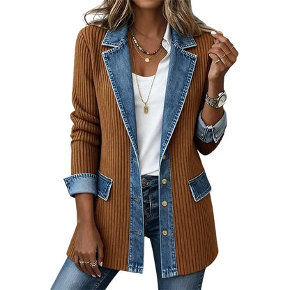 Rust-brown ribbed coat with denim lapels, flap pockets and gold buttons, worn over a white top and jeans. 14