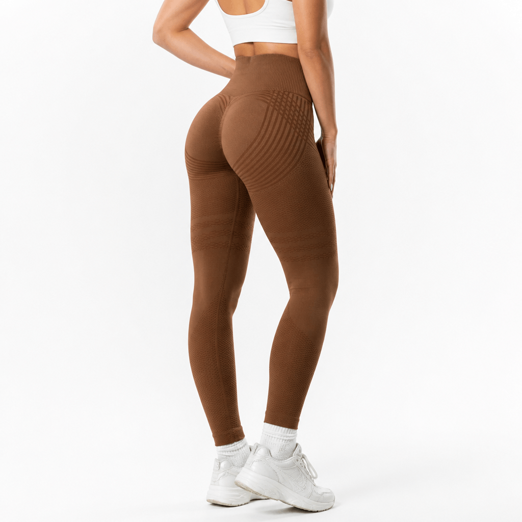 Rear view of brown leggings showing curved stripes across the seat, textured thigh bands and a ribbed high waistband. 18